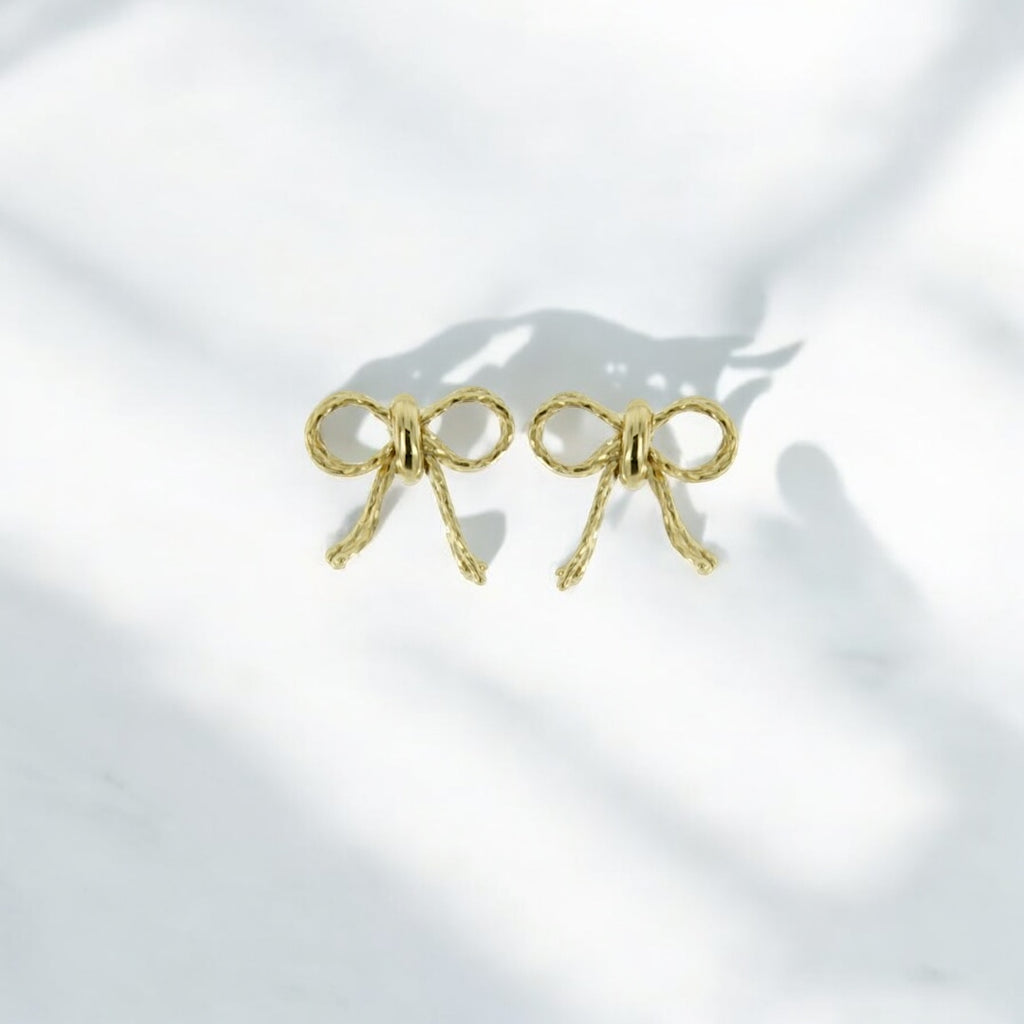 Orecchini fiocchetto in oro 9kt