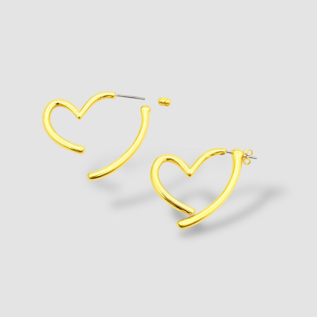 Orecchini a cuore vuoto bombati in argento 925 placcato oro giallo